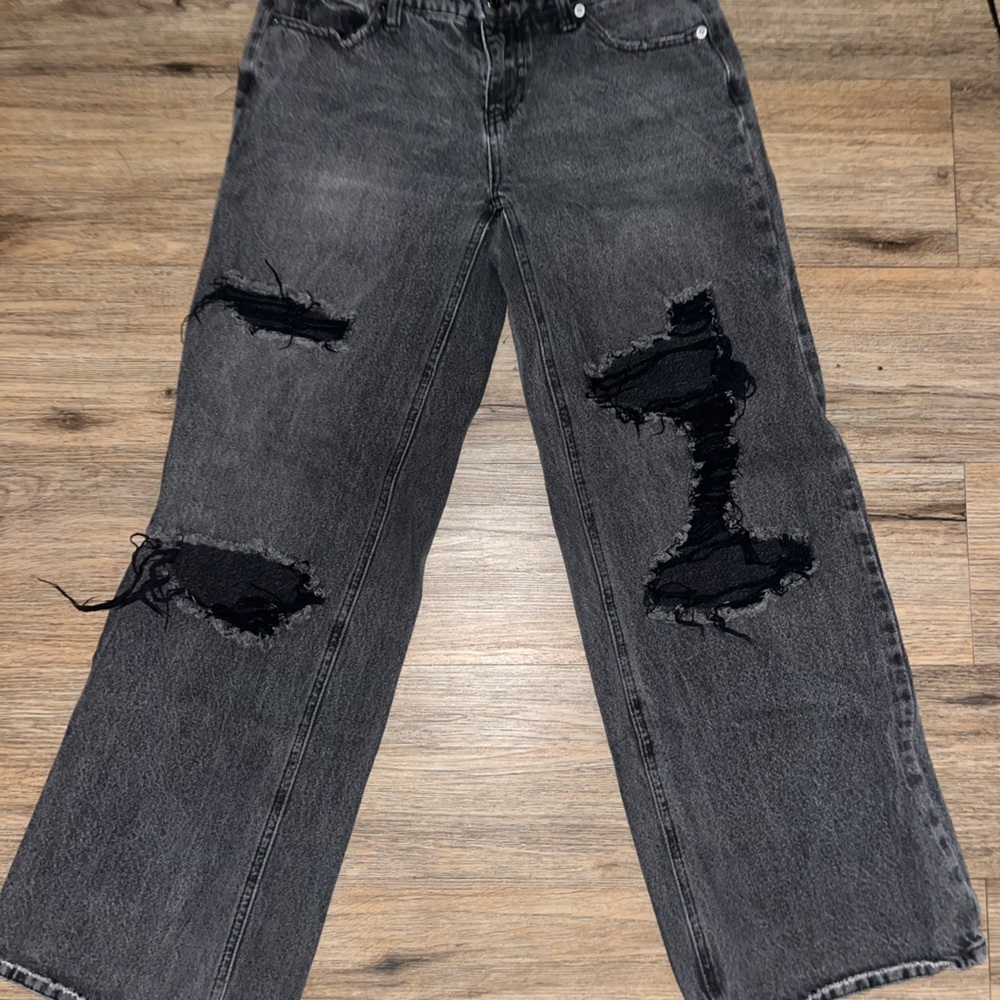 Super low waisted black distressed jeans